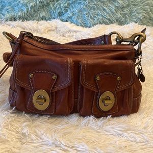 Coach brown leather handbag, striped satin liner, 13inW/7inH..strap is 8in.